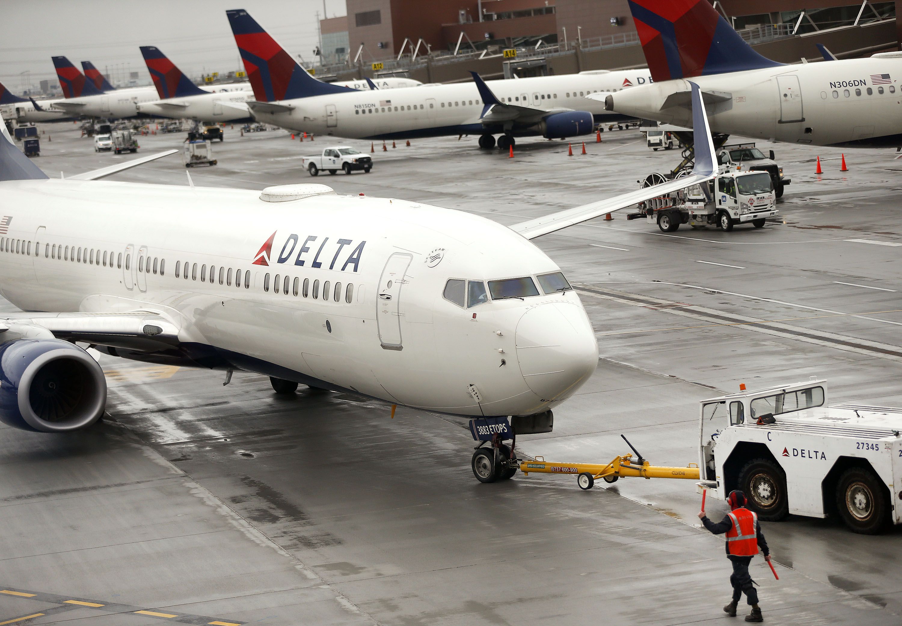 A Delta plane departs from a hangar at the Salt Lake City International Airport in Salt Lake City on Thursday, March 11, 2021. The airport had nearly 11 million passengers board in 2021, making it the 20th busiest American airport according to a preliminary report