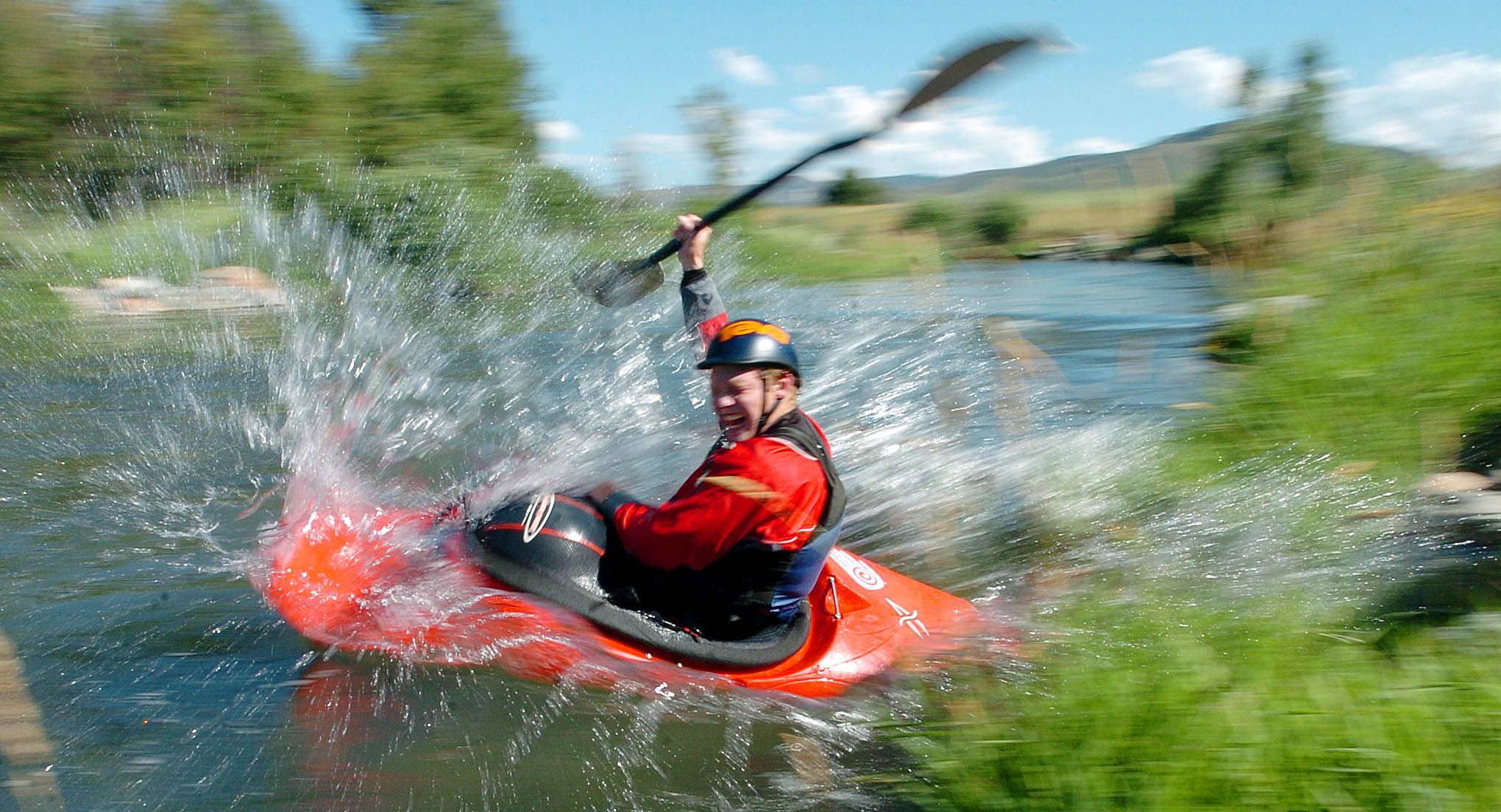 Cory Volt performs a shoreline slide entry as he and two friends float the Weber River near Henefer on July 20, 2004. Morgan County is the 4th healthiest community in America, according to the most recent annual rankings by U.S. News & World Report.