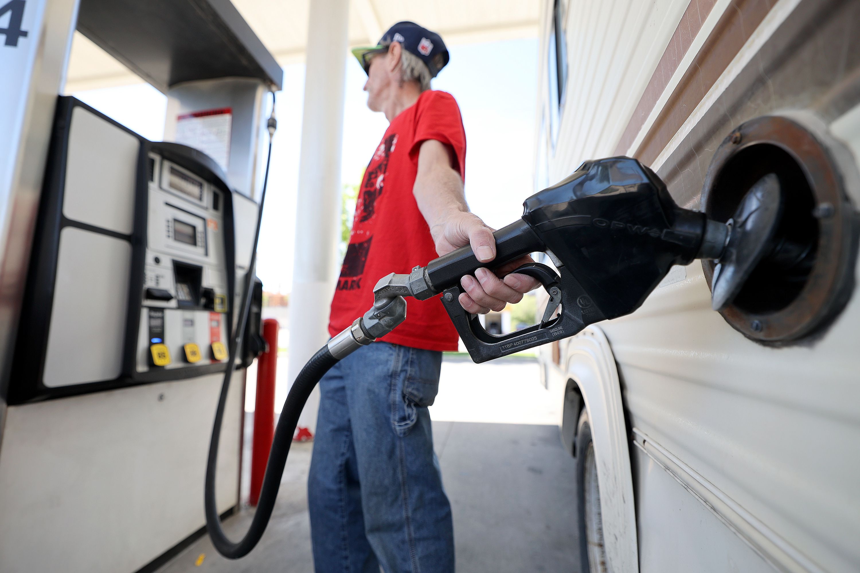 Lynn Gates pumps gas at Shopper’s Express in Salt Lake City on June 2. As gasoline and diesel prices soar to record levels, American drivers would unquestionably welcome some relief at the pump.