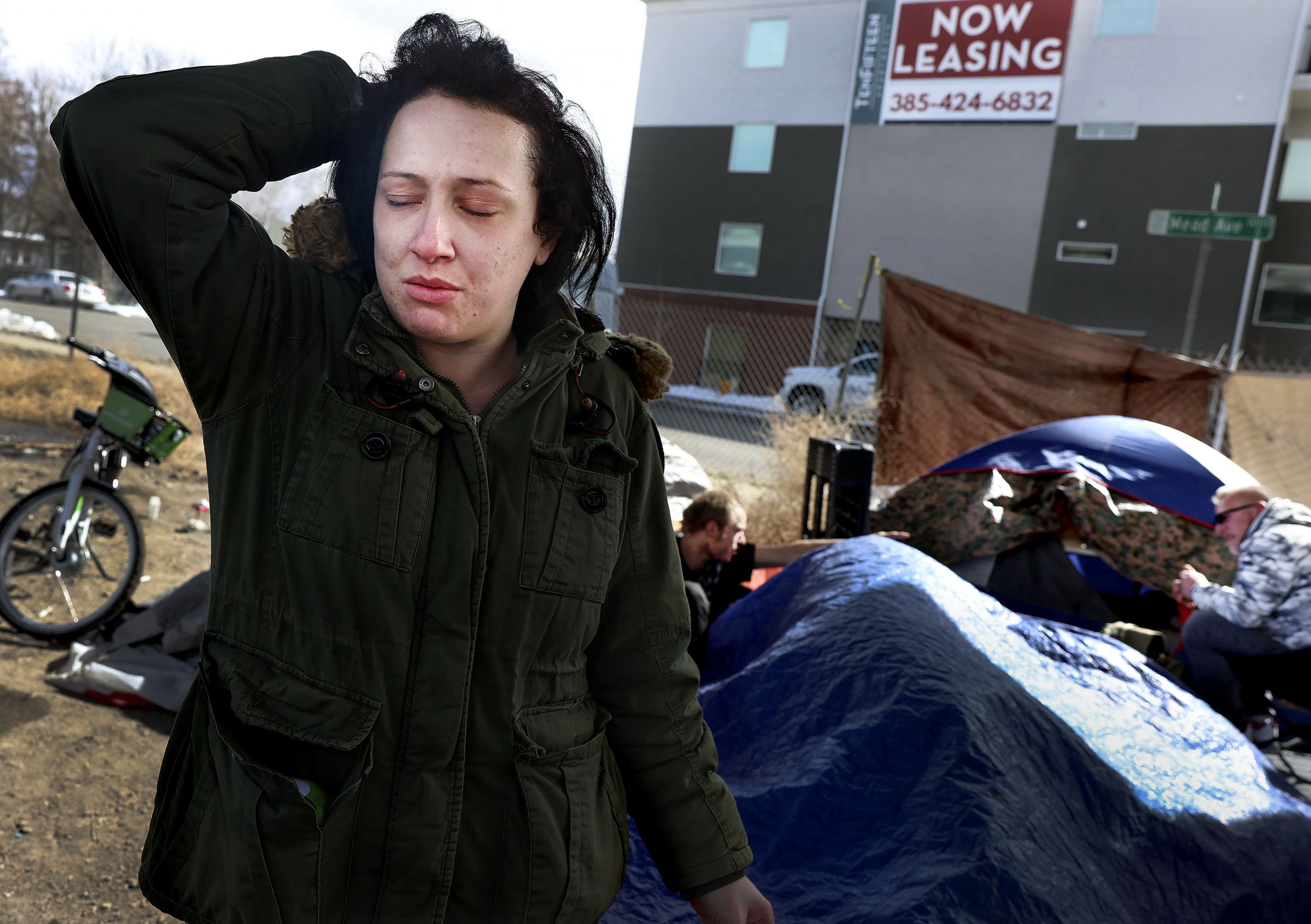 Natasha Woodhouse, 28, who has been homeless for most of her life, hangs out at a homeless camp located next to an apartment building with available space in Salt Lake City on March 9. Utah’s homeless population is increasing, according to the state’s 2022 homelessness report released Wednesday by the Utah Department of Workforce Services’ Office of Homeless Services.
