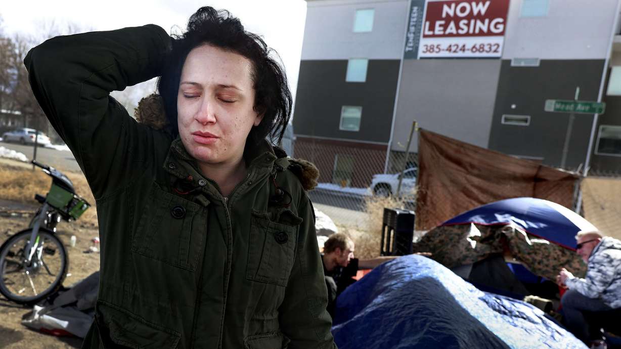 Natasha Woodhouse, 28, who has been homeless for most of her life, hangs out at a homeless camp located next to an apartment building with available space in Salt Lake City on March 9. Utah’s homeless population is increasing, according to the state’s 2022 homelessness report released Wednesday by the Utah Department of Workforce Services’ Office of Homeless Services.