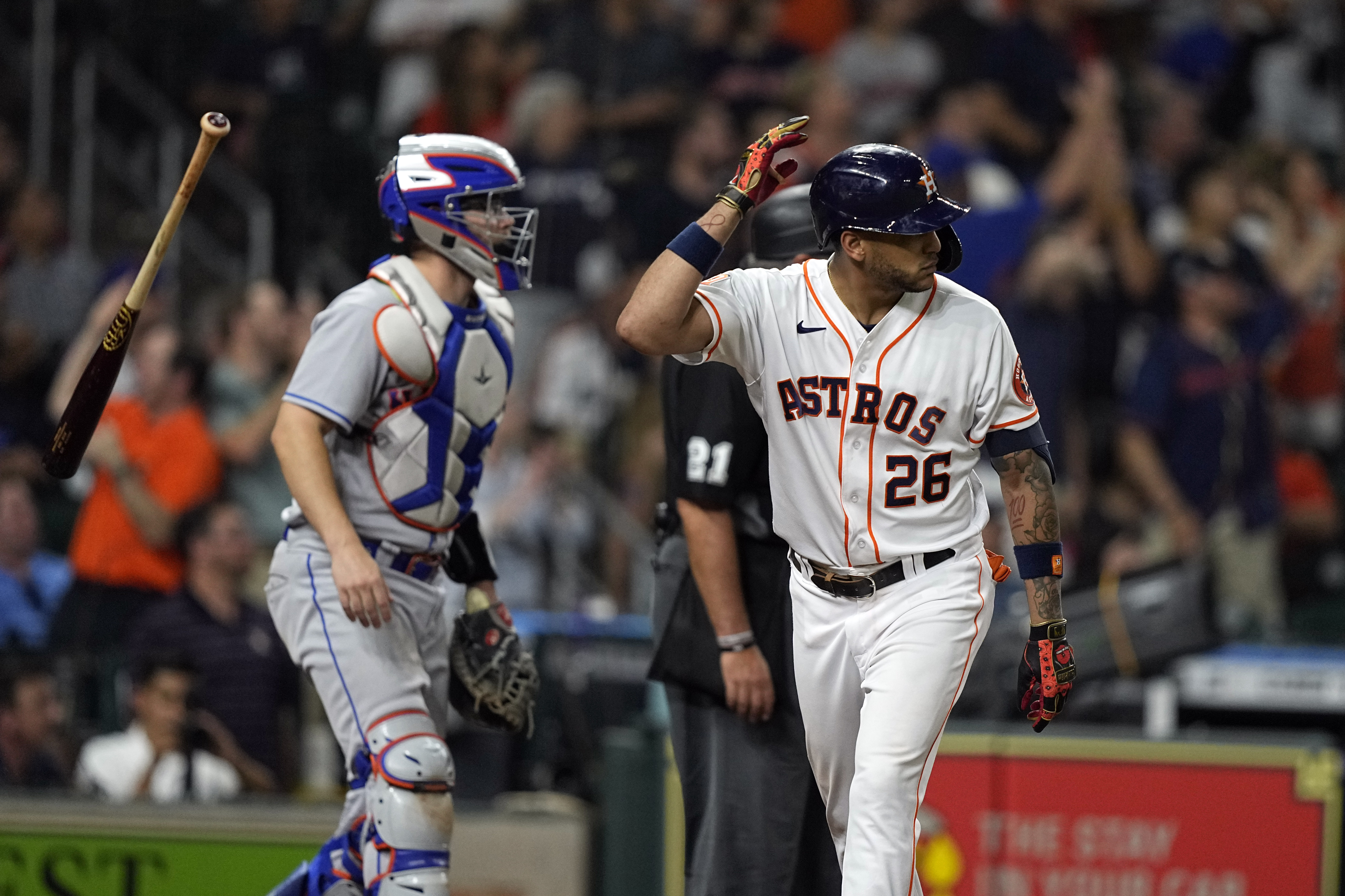 Houston Astros' Jose Siri (26) flips his bat after hitting a home run as New York Mets catcher Patrick Mazeika watches during the eighth inning of a baseball game Tuesday, June 21, 2022, in Houston. 