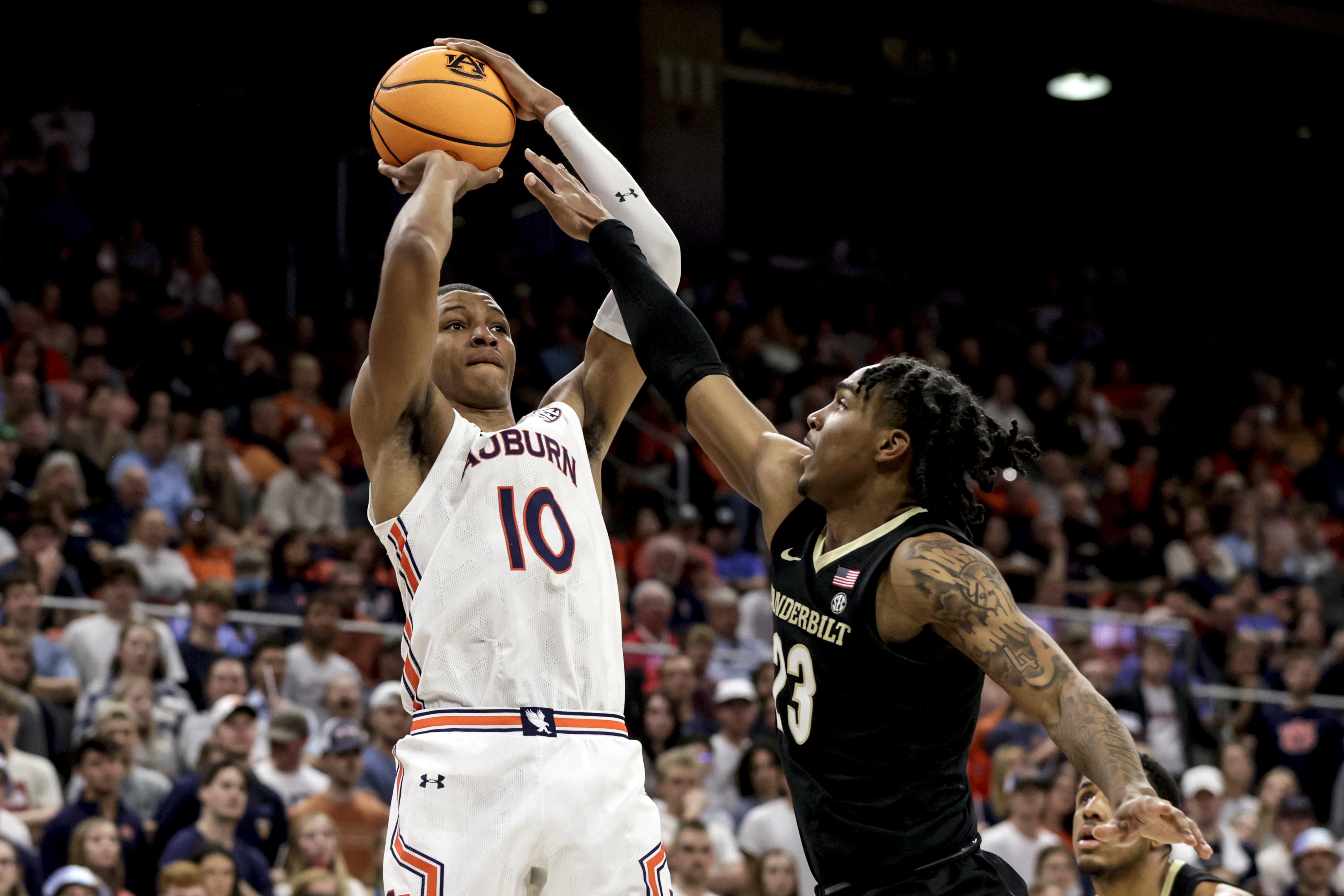 FILE - Auburn forward Jabari Smith (10) shoots a 3-pointer over Vanderbilt guard Jamaine Mann (23) during the second half of an NCAA college basketball game Feb. 16, 2022, in Auburn, Ala. Smith is one of the top forwards in the upcoming NBA draft. 