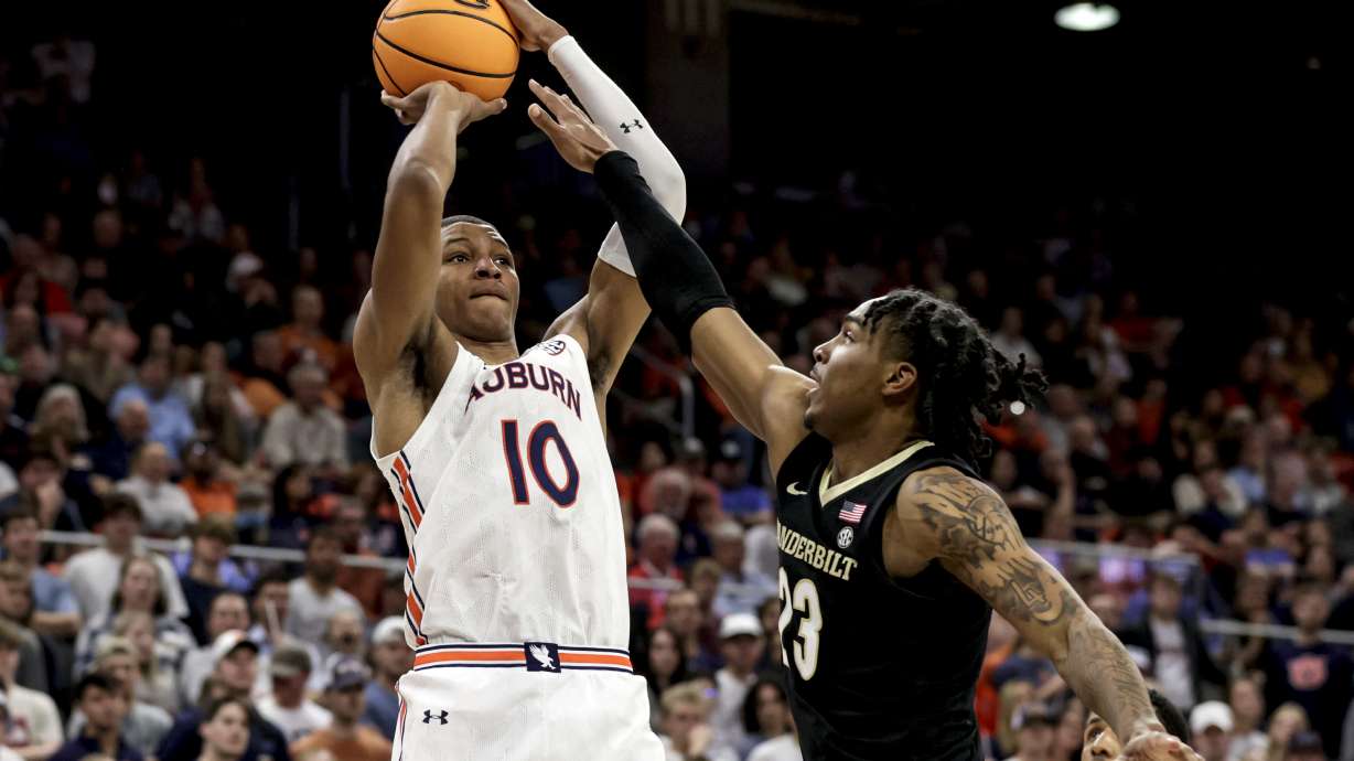 FILE - Auburn forward Jabari Smith (10) shoots a 3-pointer over Vanderbilt guard Jamaine Mann (23) during the second half of an NCAA college basketball game Feb. 16, 2022, in Auburn, Ala. Smith is one of the top forwards in the upcoming NBA draft.
