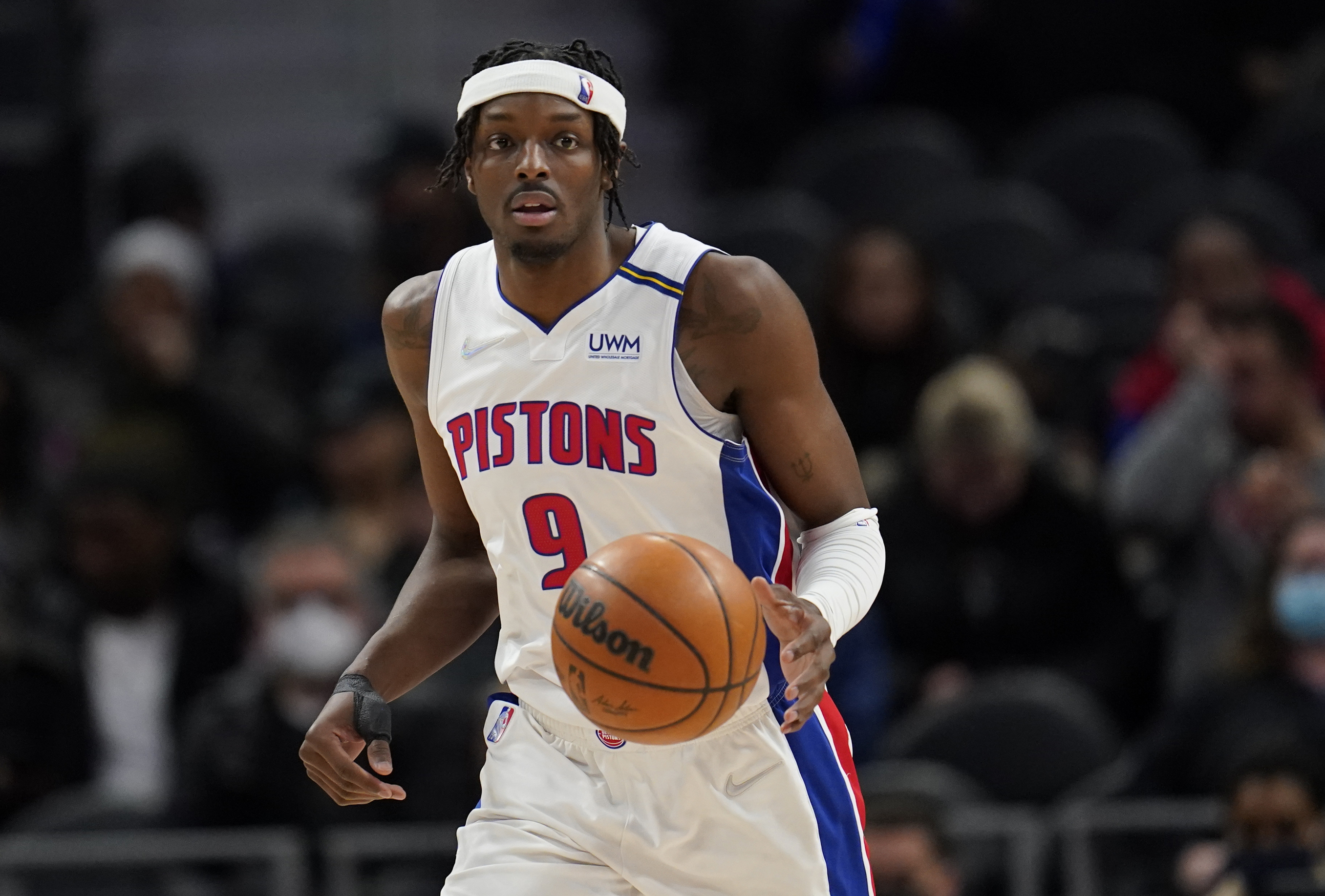 FILE - Detroit Pistons forward Jerami Grant brings the ball up against the Minnesota Timberwolves during the second half of an NBA basketball game in Detroit, Feb. 3, 2022. A person with knowledge of the move said the Pistons agreed Wednesday, June 22, to trade Grant to the Portland Trail Blazers. 