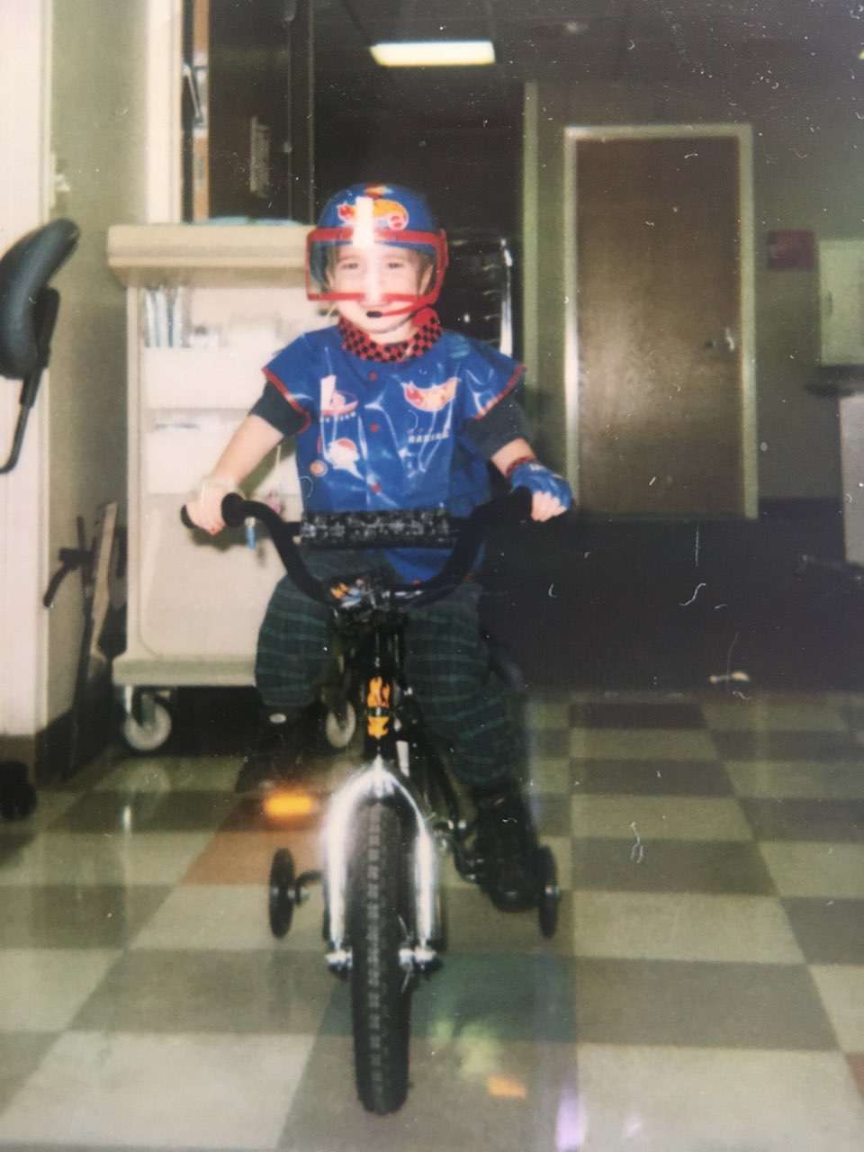 Jon Hochstein rides a bike through hospital halls while he was waiting for a heart transplant at Primary Children's Hospital.