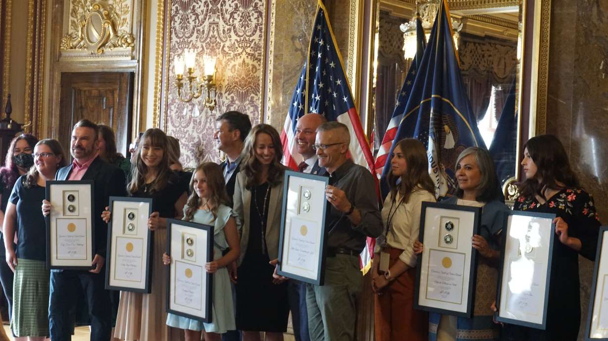 Recipients of the first annual Governor's Spirit of Service award pose for a photograph on Wednesday.