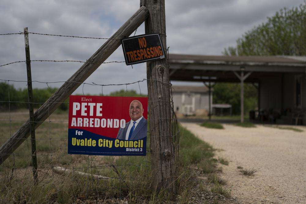 A campaign sign for Pete Arredondo, the chief of police for the Uvalde Consolidated Independent School District, hangs on a fence in Uvalde, Texas May 30. The district’s superintendent said Wednesday, June 22 that Arredondo has been put on leave following allegations that he erred in his response to a mass shooting at an elementary school that left 19 students and two teachers dead.