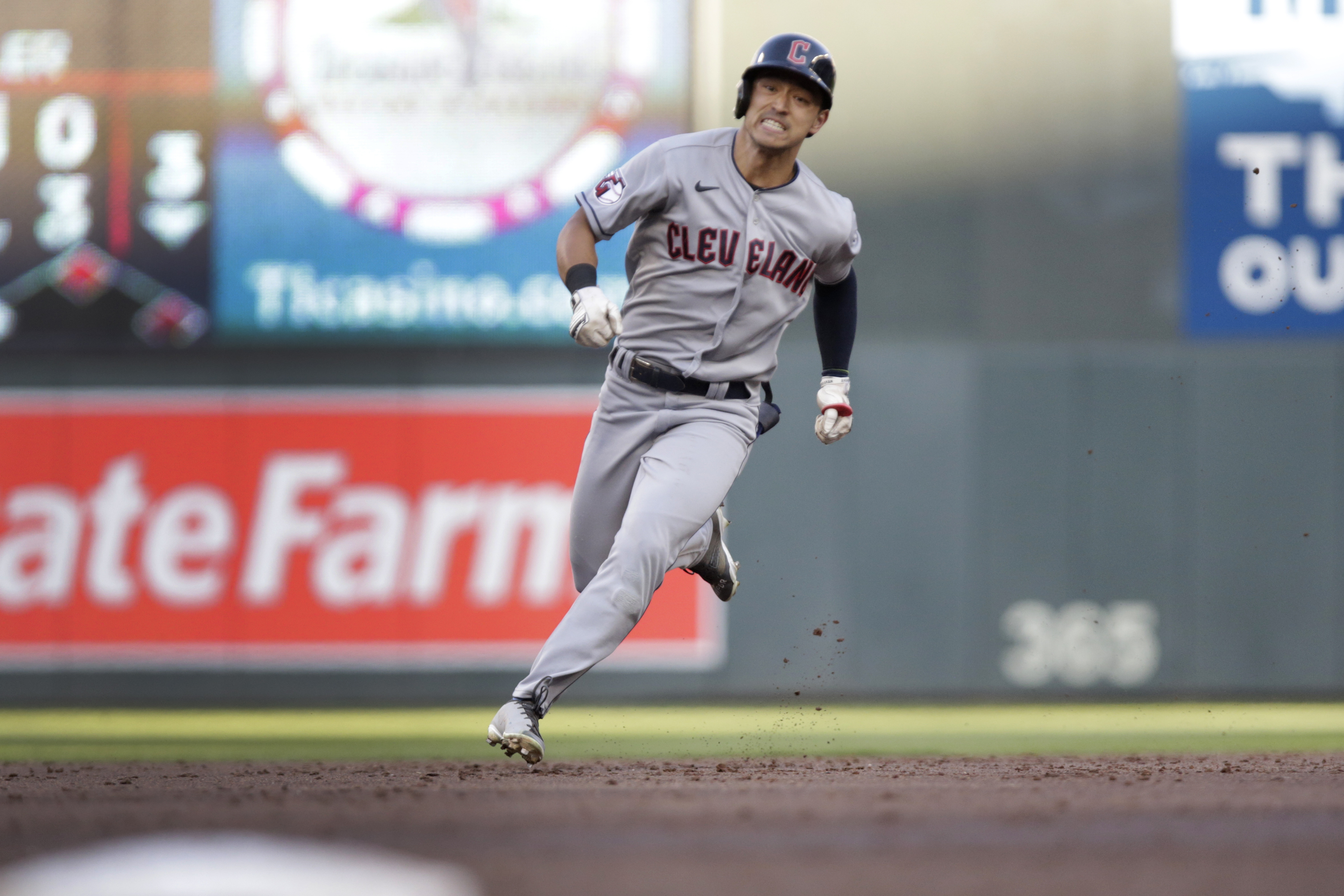 Cleveland Guardians' Steven Kwan runs to third base on an RBI triple against the Minnesota Twins during the third inning of a baseball game Wednesday, June 22, 2022, in Minneapolis. 