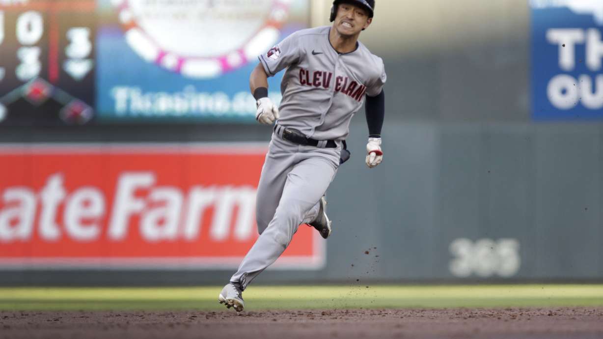 Cleveland Guardians' Steven Kwan runs to third base on an RBI triple against the Minnesota Twins during the third inning of a baseball game Wednesday, June 22, 2022, in Minneapolis.