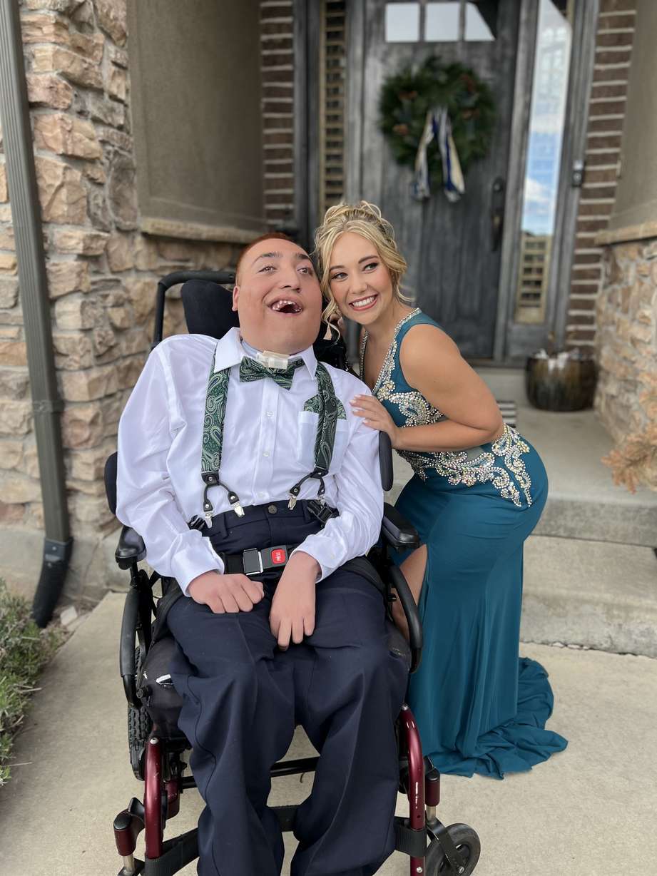 Reese Thorne poses for a senior prom picture with longtime friend Kamille Odom.
