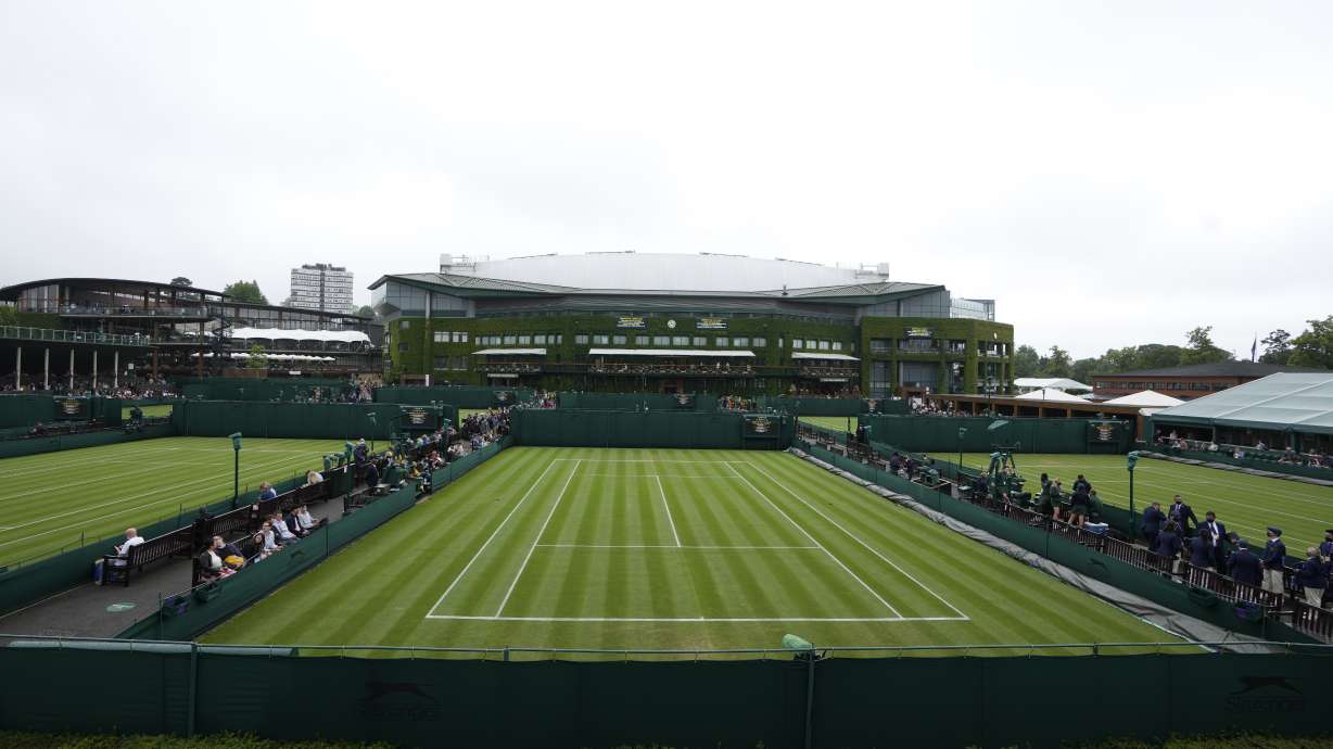 FILE -The outside courts in front of Centre Court are shown on day one of the Wimbledon Tennis Championships in London, Monday June 28, 2021. How much do you know about Wimbledon?