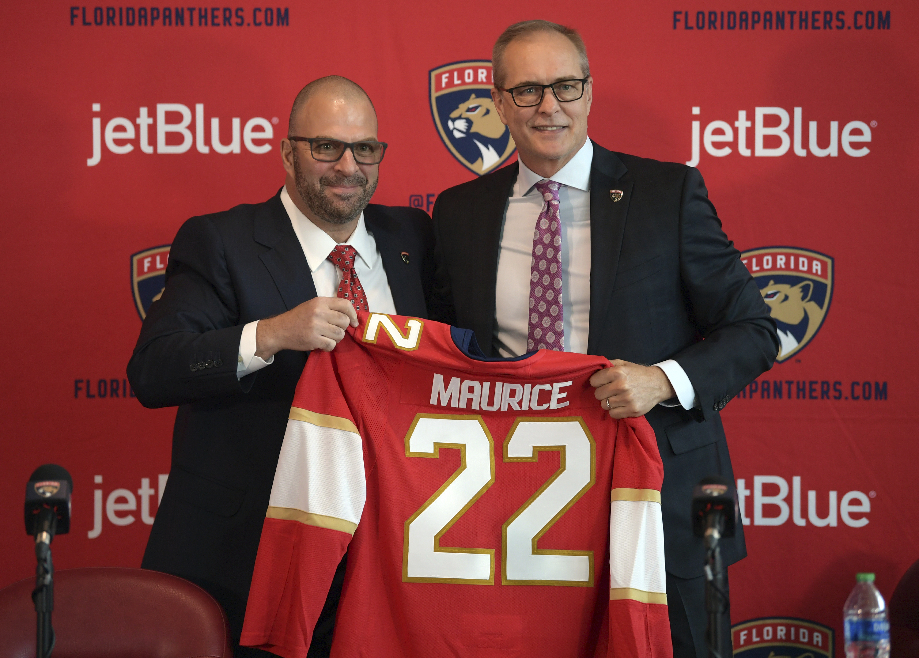 Paul Maurice, right, is introduced as the new head coach of the Florida Panthers by general manager Bill Zito, during an NHL hockey news conference at FLA Live Arena, Friday, June 23, 2022, in Sunrise, Fla.