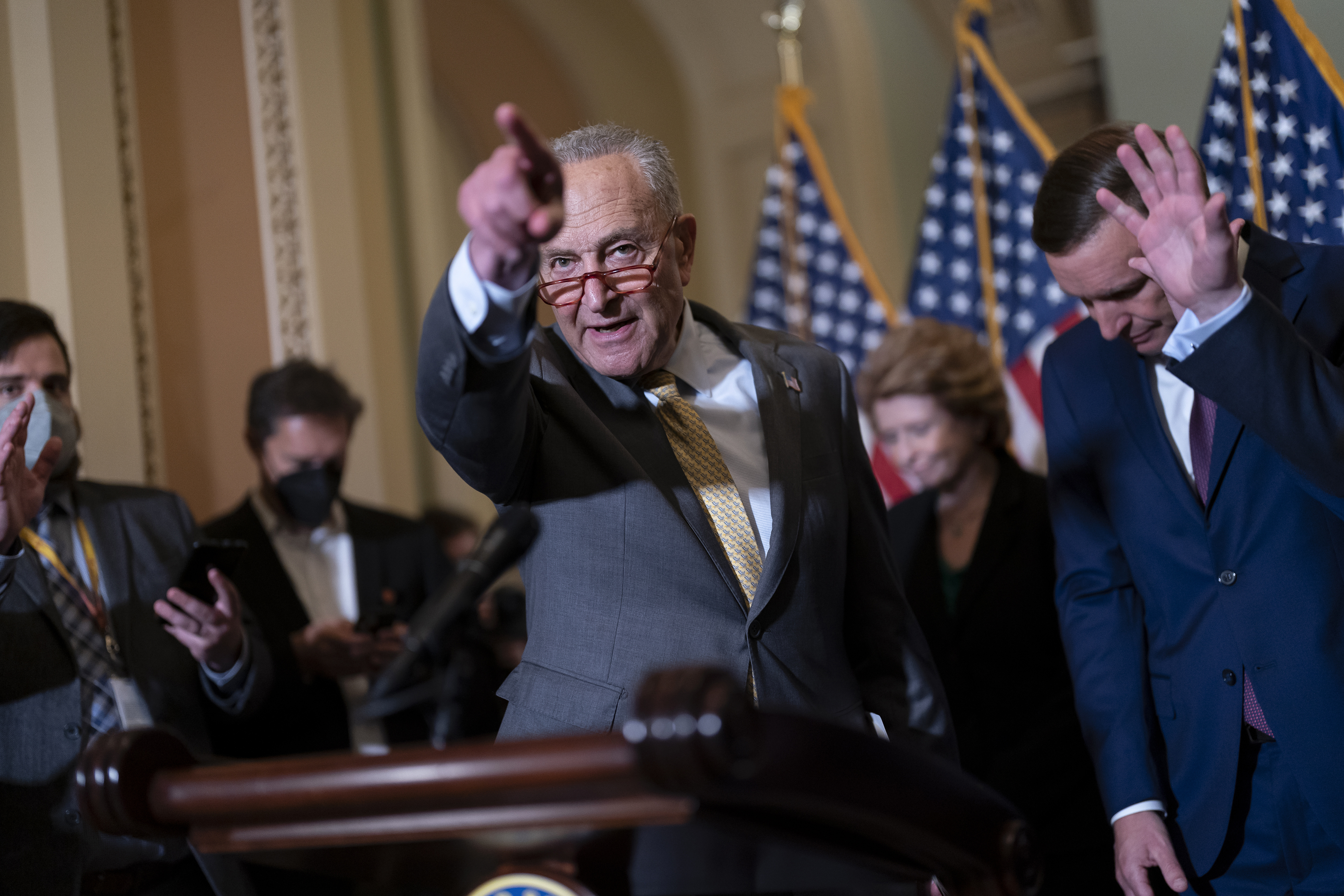Senate Majority Leader Chuck Schumer, D-N.Y., joined at right by Sen. Chris Murphy, D-Conn., speaks with reporters following a closed-door policy lunch, at the Capitol in Washington, on June 14. The Senate easily approved a bipartisan gun violence bill Thursday.