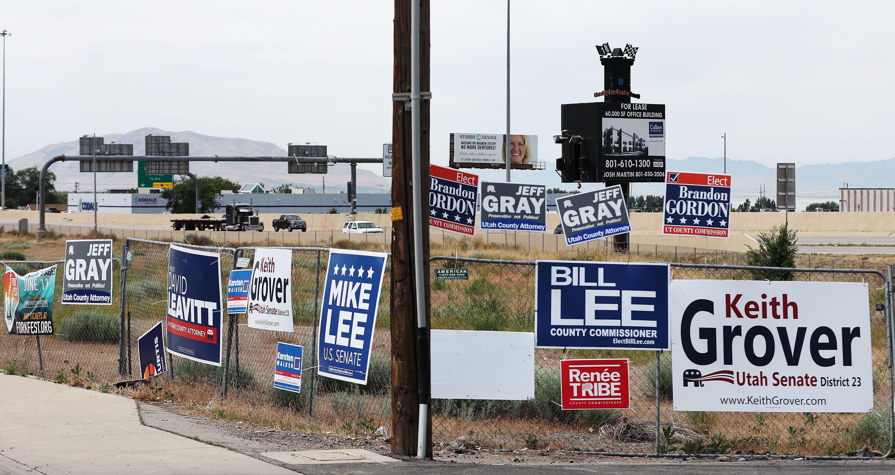 Campaigns signs are displayed near I-15 in Orem on Wednesday. Utah Sen. Mike McKell has filed a bill that would crack down on illegal placement of campaign signs.