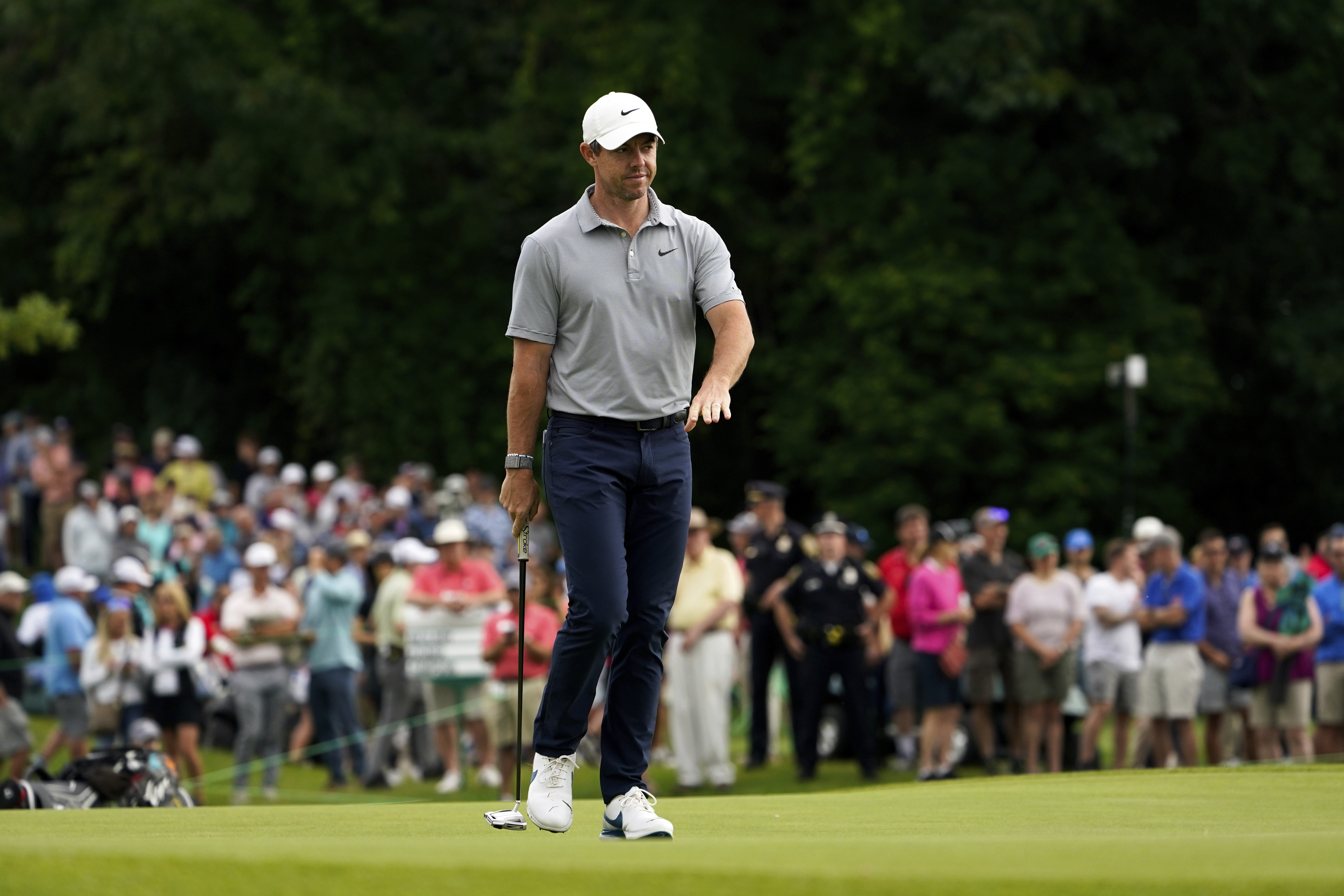 Rory McIlroy, of Northern Ireland, reacts after a shot on the 12th green during the first round of the Travelers Championship golf tournament at TPC River Highlands, Thursday, June 23, 2022, in Cromwell, Conn. 