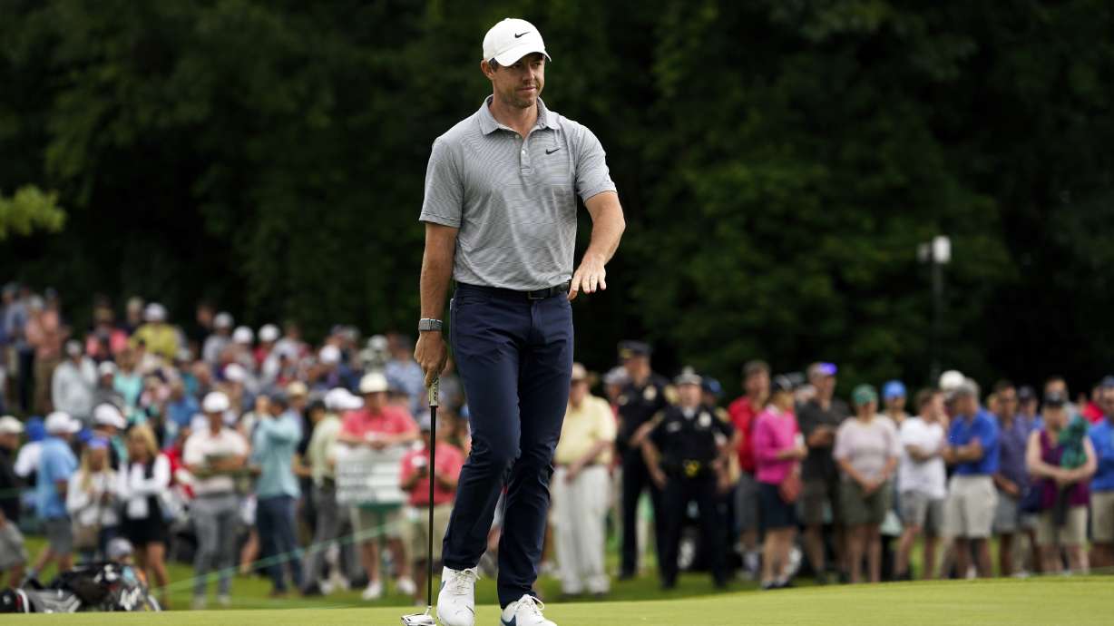 Rory McIlroy, of Northern Ireland, reacts after a shot on the 12th green during the first round of the Travelers Championship golf tournament at TPC River Highlands, Thursday, June 23, 2022, in Cromwell, Conn.