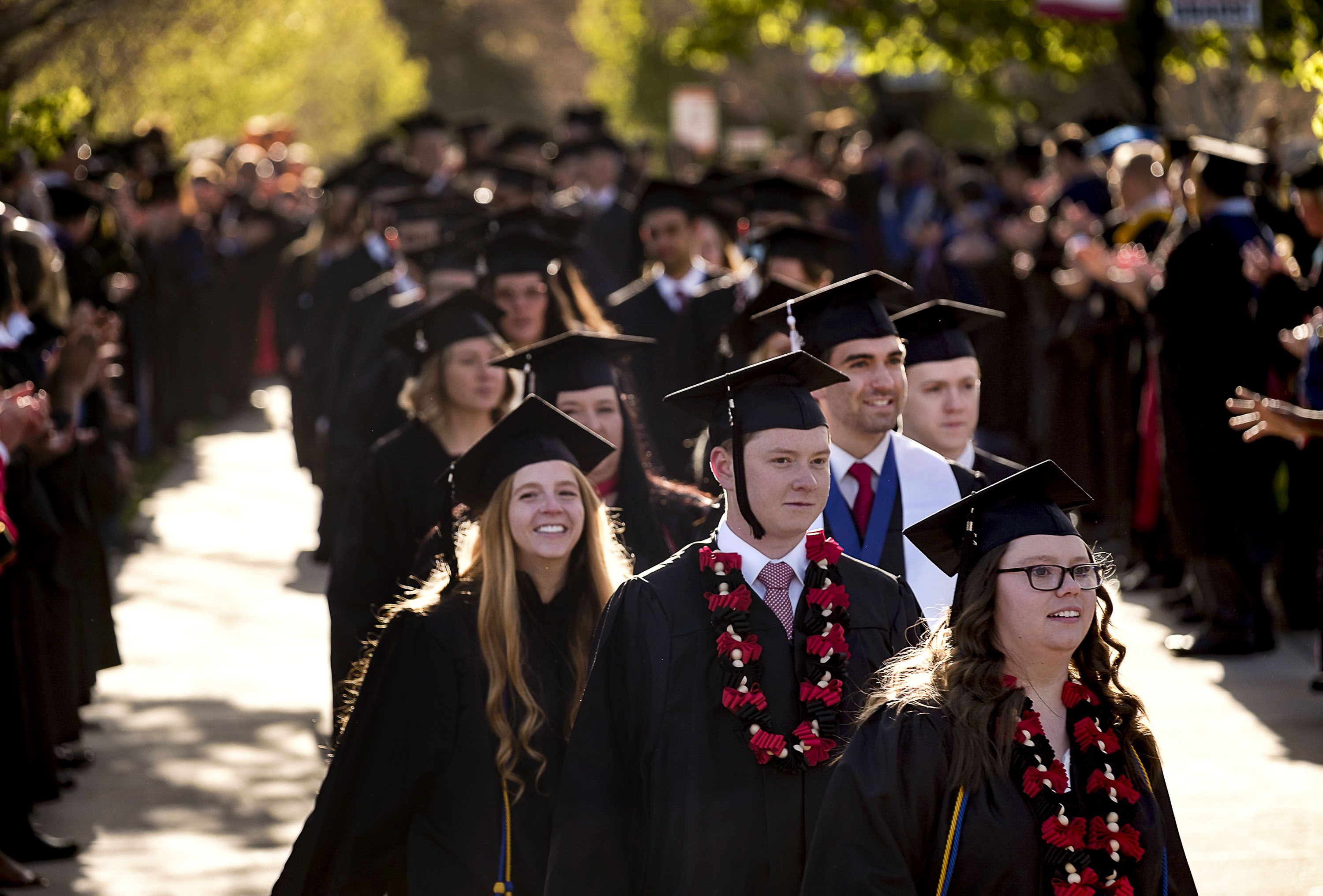 Graduating students walk in the processional to the 123rd annual commencement for Southern Utah University in Cedar City on April 19. As the Biden administration ponders student loan forgiveness, Dartmouth College will eliminate student loans from financial aid packages for undergraduate students, extending more grants instead.
