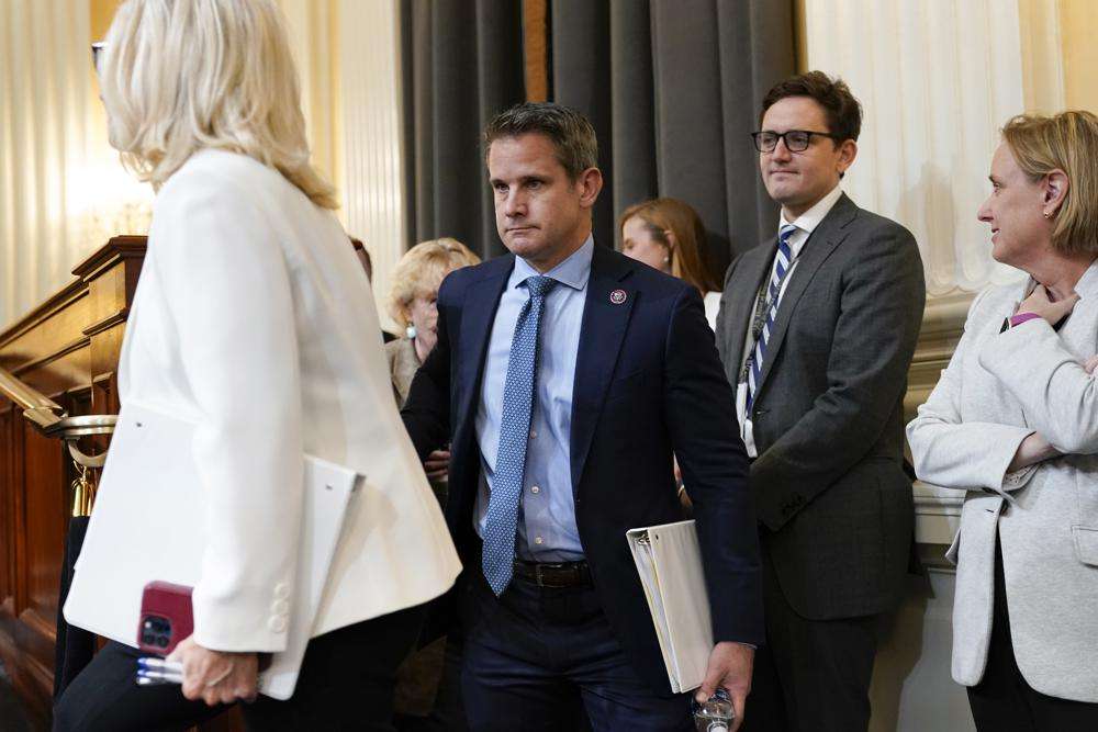 Vice Chair Liz Cheney, R-Wyo., left, and Rep. Adam Kinzinger, R-Ill., arrive as the House select committee investigating the Jan. 6 attack on the U.S. Capitol continues to reveal its findings of a yearlong investigation, at the Capitol in Washington, Thursday.