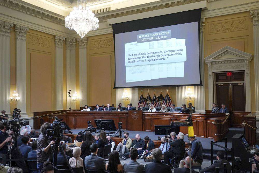 A letter from former Justice Department official Jeffrey Clark is shown on a screen, as the House select committee investigating the Jan. 6 attack on the U.S. Capitol continues to reveal its findings of a year-long investigation, Thursday, at the Capitol in Washington.