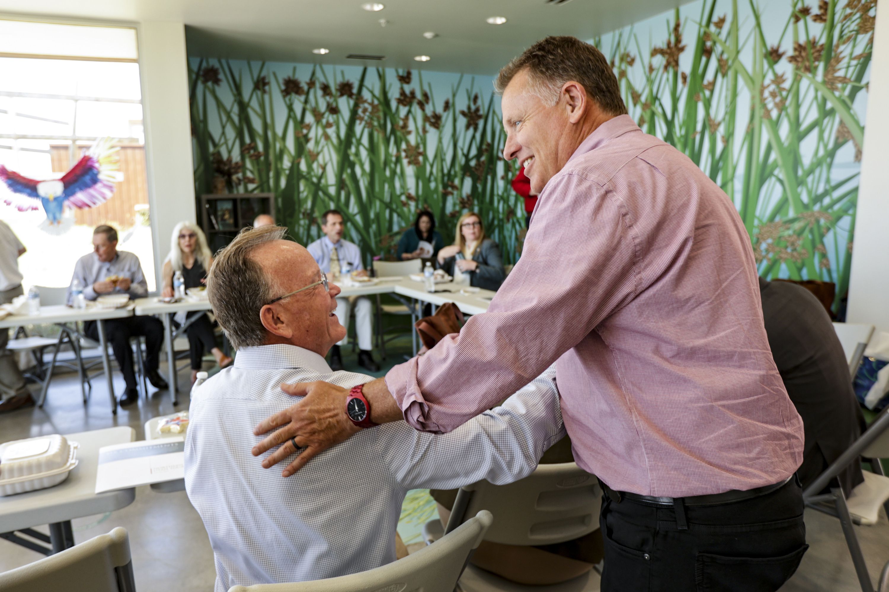 Senate President Stuart Adams, R-Layton, left, shakes hands with University of Utah President Taylor Randall at the George S. and Dolores Doré Eccles Wildlife Education Center in Farmington on Thursday, before a roundtable discussion on issues concerning the Great Salt Lake.