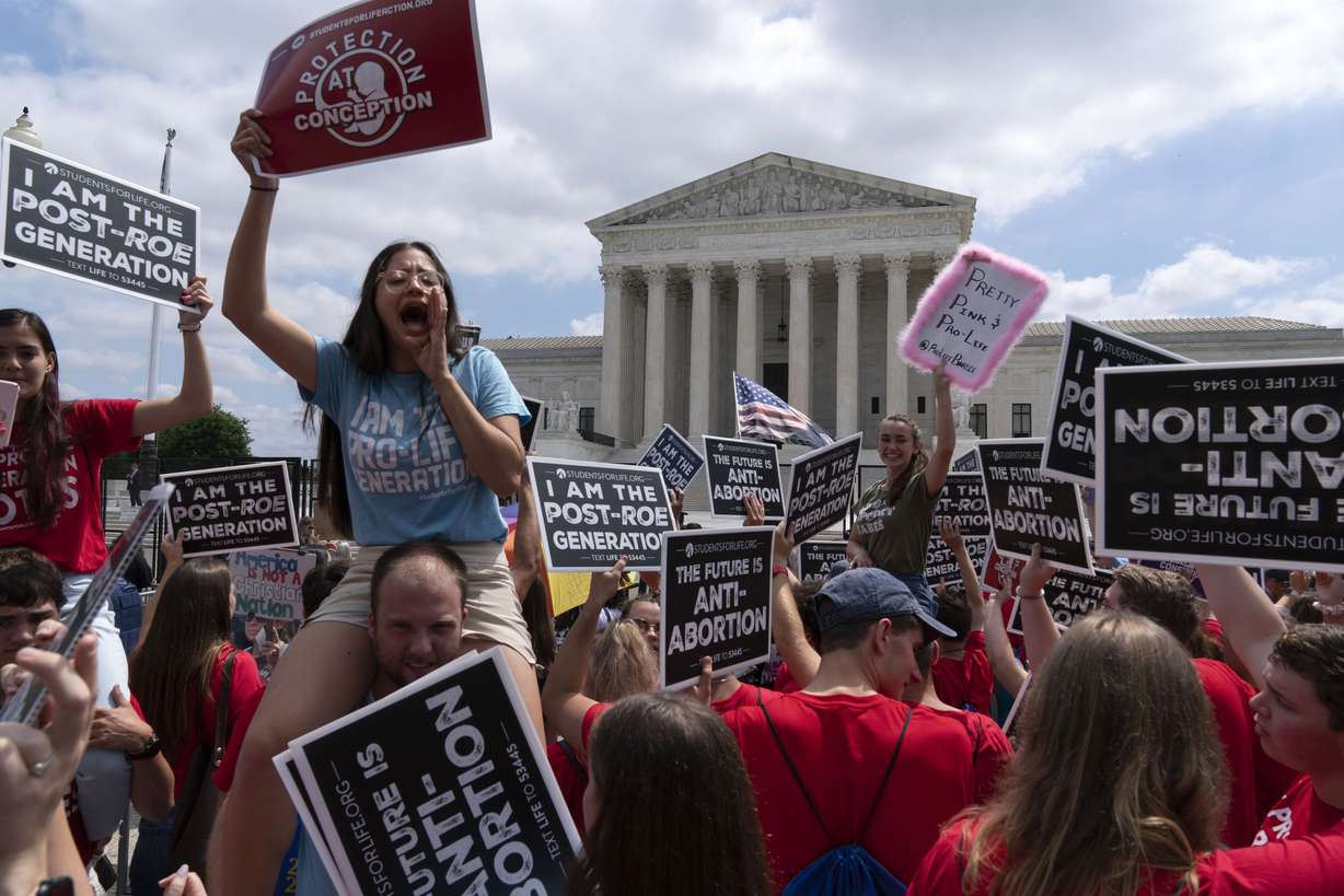 Anti-abortion protesters celebrate outside the Supreme Court in Washington. The Supreme Court has ended constitutional protections for abortion that had been in place nearly 50 years, a decision by its conservative majority to overturn the court’s landmark abortion cases.