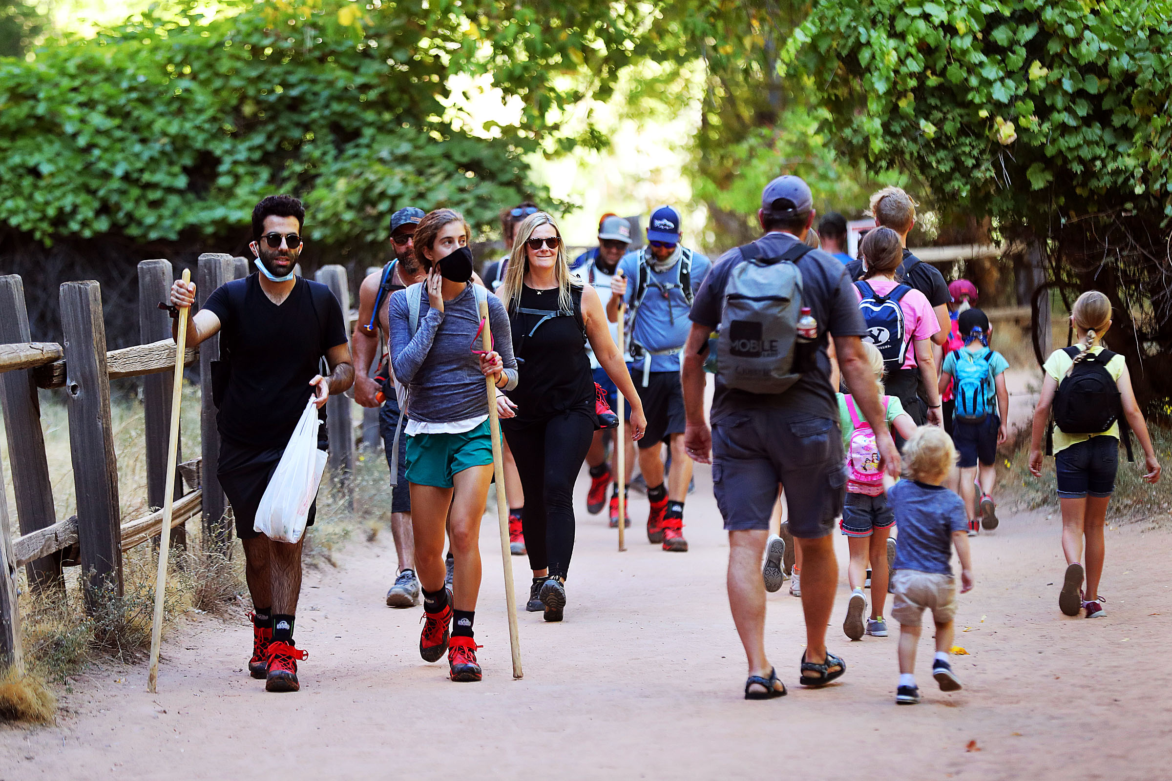 Visitors hike at Zion National Park. Oct. 14, 2020. The Department of the Interior announced on Friday that visitor spending in communities near national parks in 2021 resulted in a $42.5 billion benefit to the nation’s economy and supported 322,600 mostly local jobs.