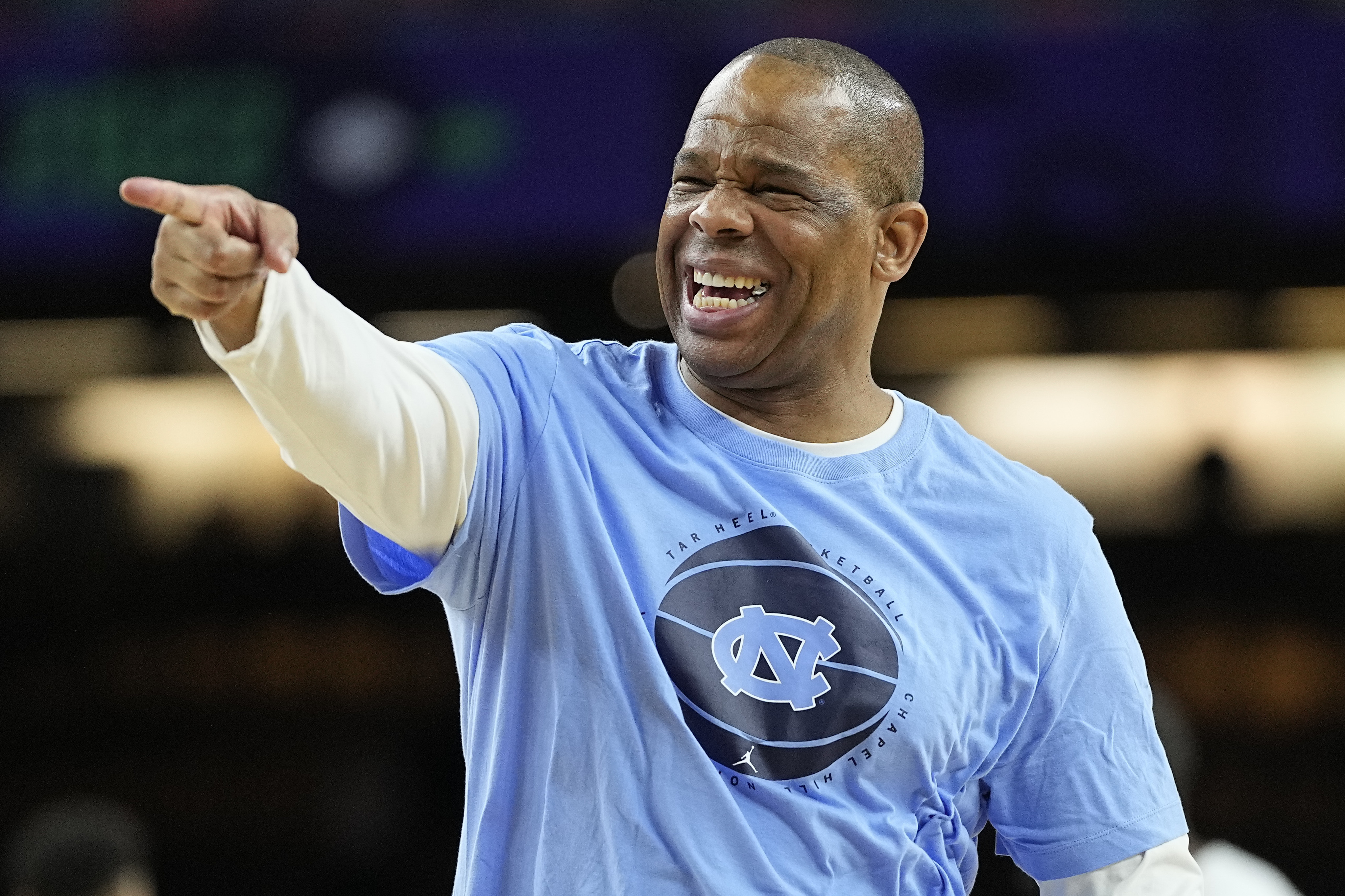 FILE - North Carolina head coach Hubert Davis points during practice at the men's Final Four NCAA college basketball tournament, on April 1, 2022, in New Orleans. National runner-up North Carolina, a strong contender for the No. 1 spot in the preseason polls with four starters returning, will play at Indiana in the ACC/Big Ten Challenge on Nov. 30. 