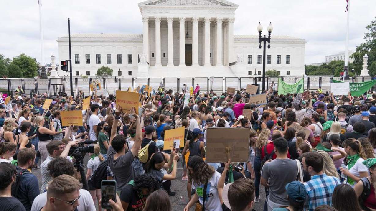 Protesters gather outside the Supreme Court in Washington, Friday. The Supreme Court has ended constitutional protections for abortion that had been in place nearly 50 years, a decision by its conservative majority to overturn the court's landmark abortion cases.