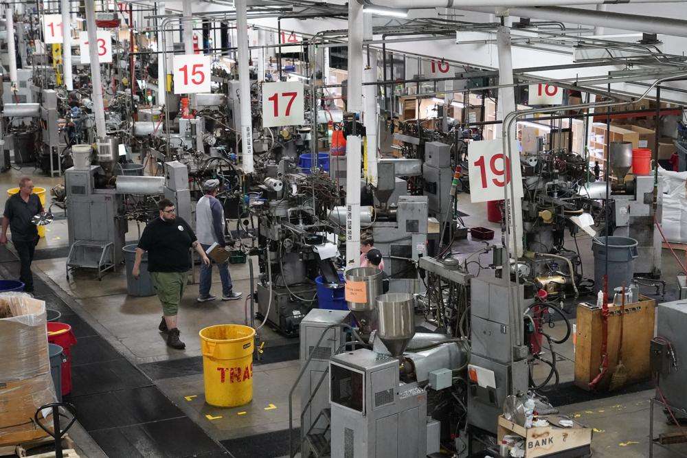 Workers operate record pressing machinery at the United Record Pressing facility Thursday in Nashville, Tenn. The arrival of the compact disc nearly killed off record albums. Four decades later, with resuscitated record album sales producing double-digit growth, manufacturers are rapidly rebuilding an industry to keep pace with sales that topped $1 billion last year.