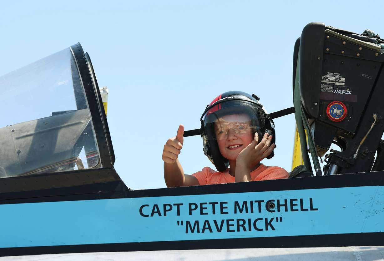 Aiden Silvas, 10, sits in a F-18 plane during Warriors Over the Wasatch Air and Space Show at Hill Air Fore Base in Layton on Saturday.