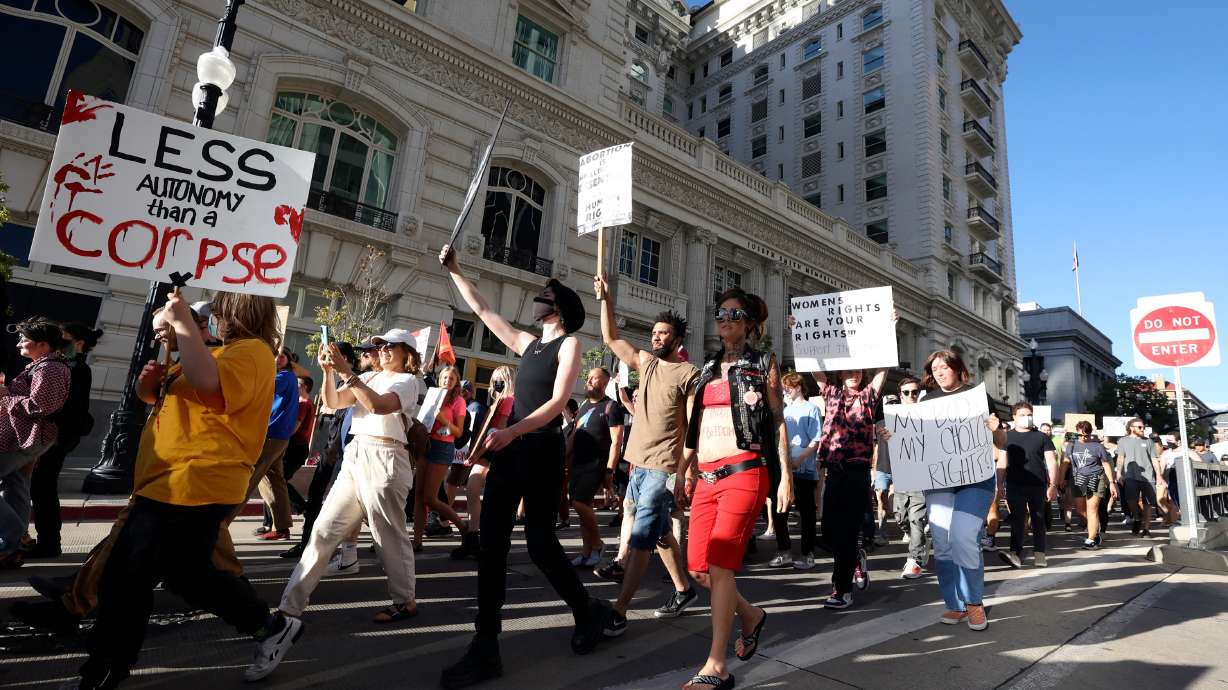 Protesters march from Washington Square Park to the Capitol in response to the Supreme Court’s decision to overturn Roe v. Wade in Salt Lake City on Friday. Planned Parenthood filed a lawsuit Saturday to stop the Utah law that bans abortions with few exceptions.
