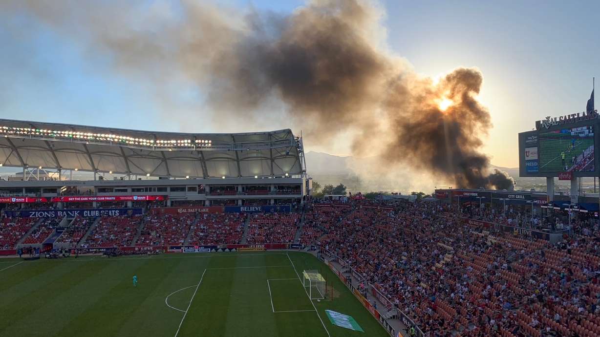 Smoke is seen outside Rio Tinto Stadium Saturday.