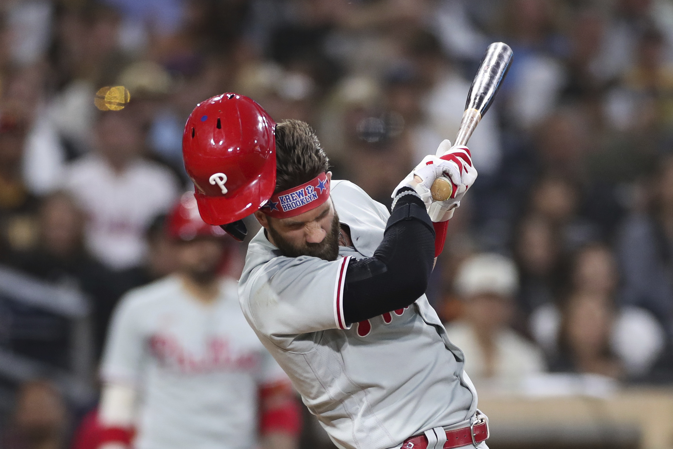 Philadelphia Phillies' Bryce Harper reacts after being hit by a pitch from San Diego Padres' Blake Snell during the fourth inning of a baseball game Saturday, June 25, 2022, in San Diego. 