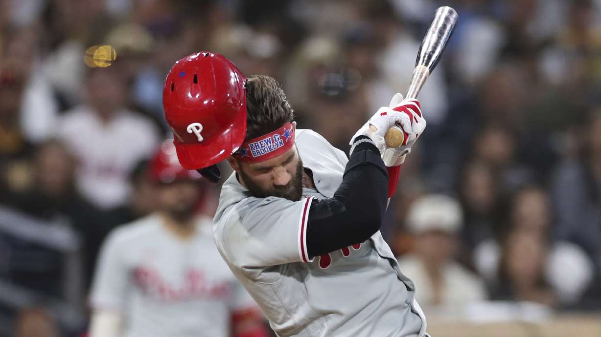 Philadelphia Phillies' Bryce Harper reacts after being hit by a pitch from San Diego Padres' Blake Snell during the fourth inning of a baseball game Saturday, June 25, 2022, in San Diego.