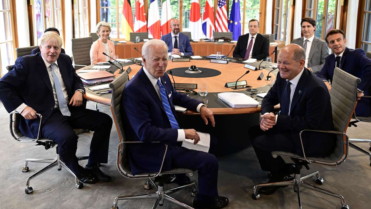 Clockwise from left, Fumio Kishida (covered), Prime Minister of Japan, Ursula von der Leyen, President of the European Commission, Charles Michel, President of the European Council, Mario Draghi, Prime Minister of Italy, Justin Trudeau, Prime Minister of Canada, Emmanuel Macron, Prime Minister of France, German Chancellor Olaf Scholz, US President Joe Biden and Boris Johnson, Prime Minister of the United Kingdom sit at the first working session in Castle Elmau in Kruen, near Garmisch-Partenkirchen, Germany, on Sunday. The Group of Seven leading economic powers are meeting in Germany for their annual gathering Sunday through Tuesday.