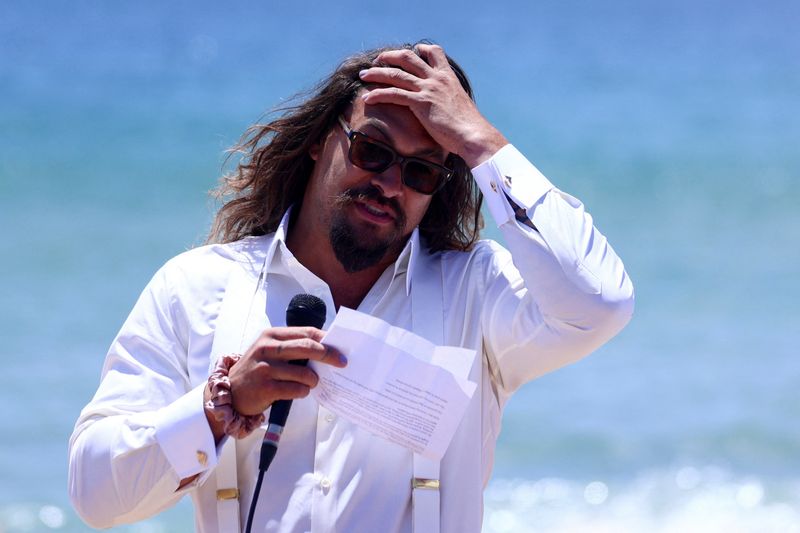 American actor and environmental activist Jason Momoa makes an appearance at a Portuguese Carcavelos beach ahead of the United Nations Ocean Conference in Lisbon, Portugal, Sunday. 