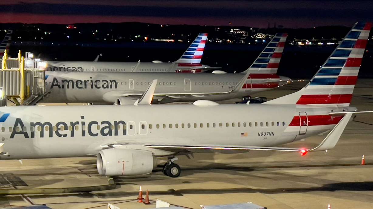American Airlines planes sit at gates at Ronald Reagan Washington National Airport (DCA) in Arlington, Virginia, on Sunday. At least 730 flights were canceled across the United States on Sunday evening, according to the flight-tracking website FlightAware.