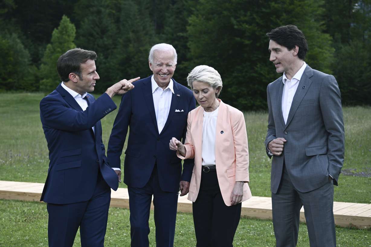 From left, President Emmanuel Macron, US President Joe Biden, European Commission President Ursula von der Leyen and Canada's Prime Minister Justin Trudeau leave after posing for a group photo , during the G7 Summit, at Castle Elmau in Kruen, near Garmisch-Partenkirchen, Germany, Sunday.