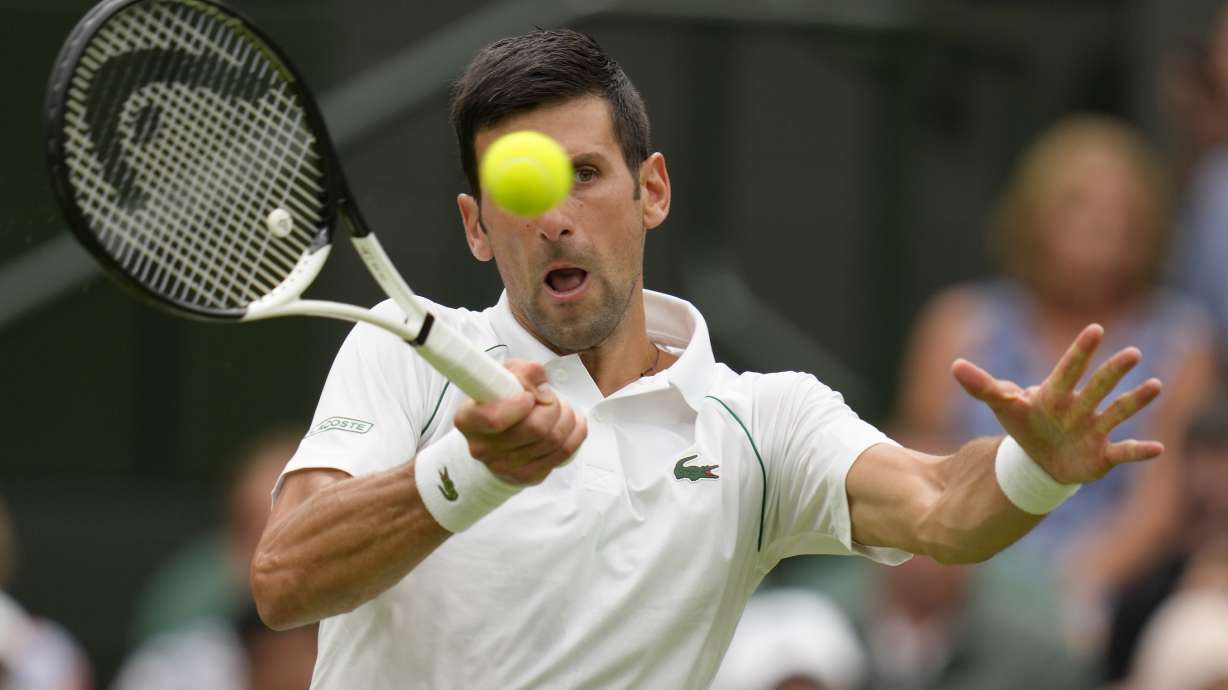 Serbia's Novak Djokovic returns to Korea's Kwon Soonwoo in a men's first round singles match on day one of the Wimbledon tennis championships in London, Monday, June 27, 2022.