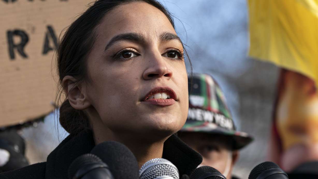 U.S. Rep. Alexandria Ocasio-Cortez, D-N.Y., speaks at a news conference on Dec. 7, 2021, on Capitol Hill in Washington. Leading Democratic women in Congress are calling on President Joe Biden to use federal lands as a "safe haven" for abortion.