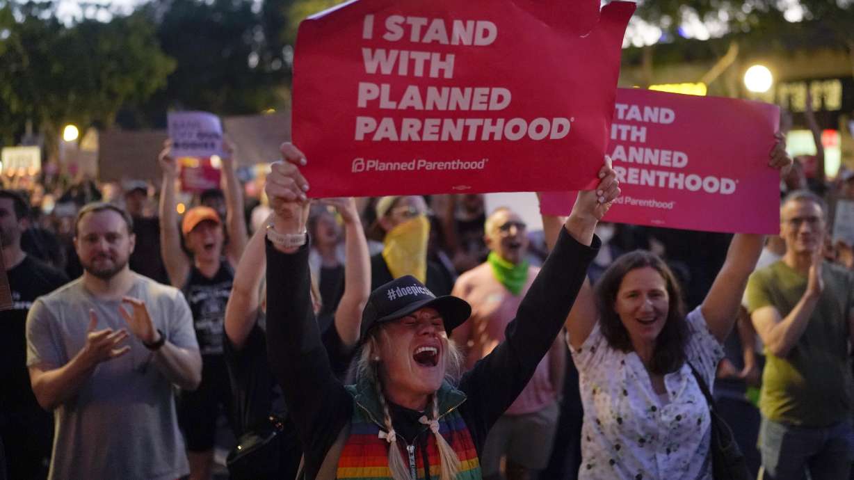 Supporters of abortion rights chant slogans outside a Planned Parenthood clinic during a protest in West Hollywood, Calif., Friday. The U.S. Supreme Court's decision to end constitutional protections for abortion has cleared the way for states to impose bans and restrictions on abortion — and will set off a series of legal battles.