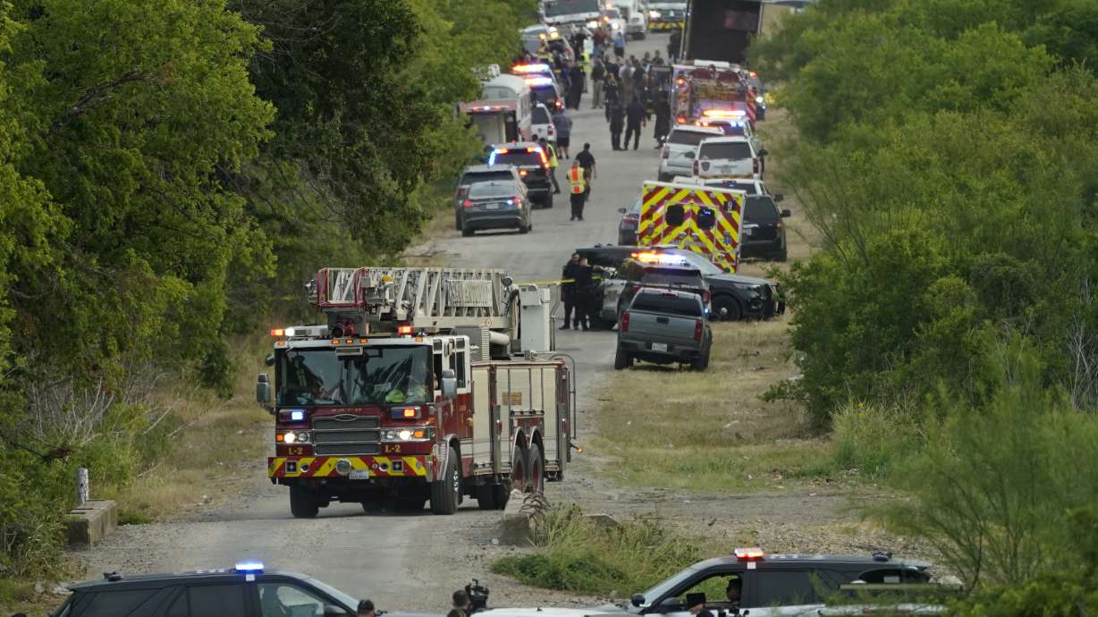 Police block the scene where a semitrailer with multiple dead bodies were discovered, Monday, in San Antonio.
