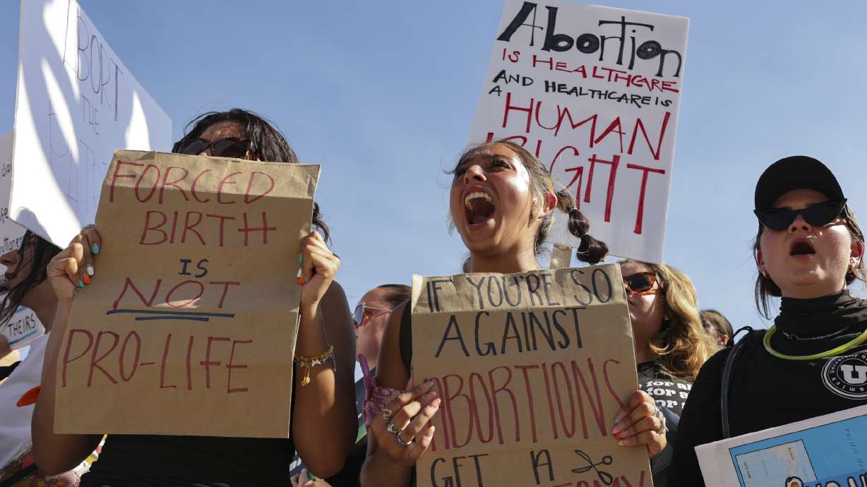 Lexy Bombela, center, screams during the pro-choice protest at the Capitol after Supreme Court overturns Roe v. Wade in Salt Lake City on Sunday.
