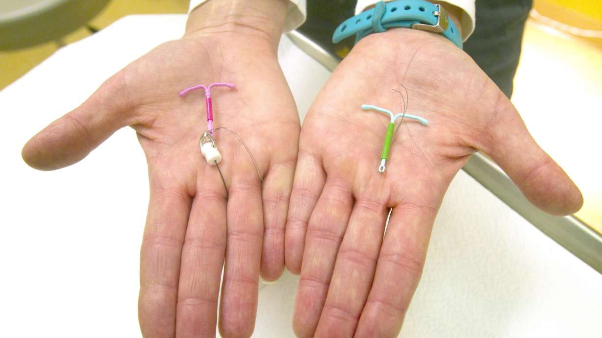 Dr. Susan Gorman displays the Skyla IUD, left, and the Mirena IUD, at High Lakes Women’s Center in Redmond, Ore., on Jan. 14, 2015. Utah not only has one of the lowest abortion rates nationally, it provides some of the least state support for family planning activities, according to government and nonprofit agencies.