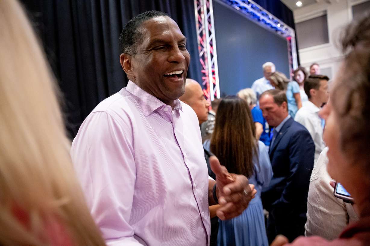 Rep. Burgess Owens, R-Utah, greets supporters at an event for candidates in the GOP primary election at the Awaken Event Center in South Jordan on Tuesday. Owens was projected to win his race against Republican challenger Jake Hunsaker.