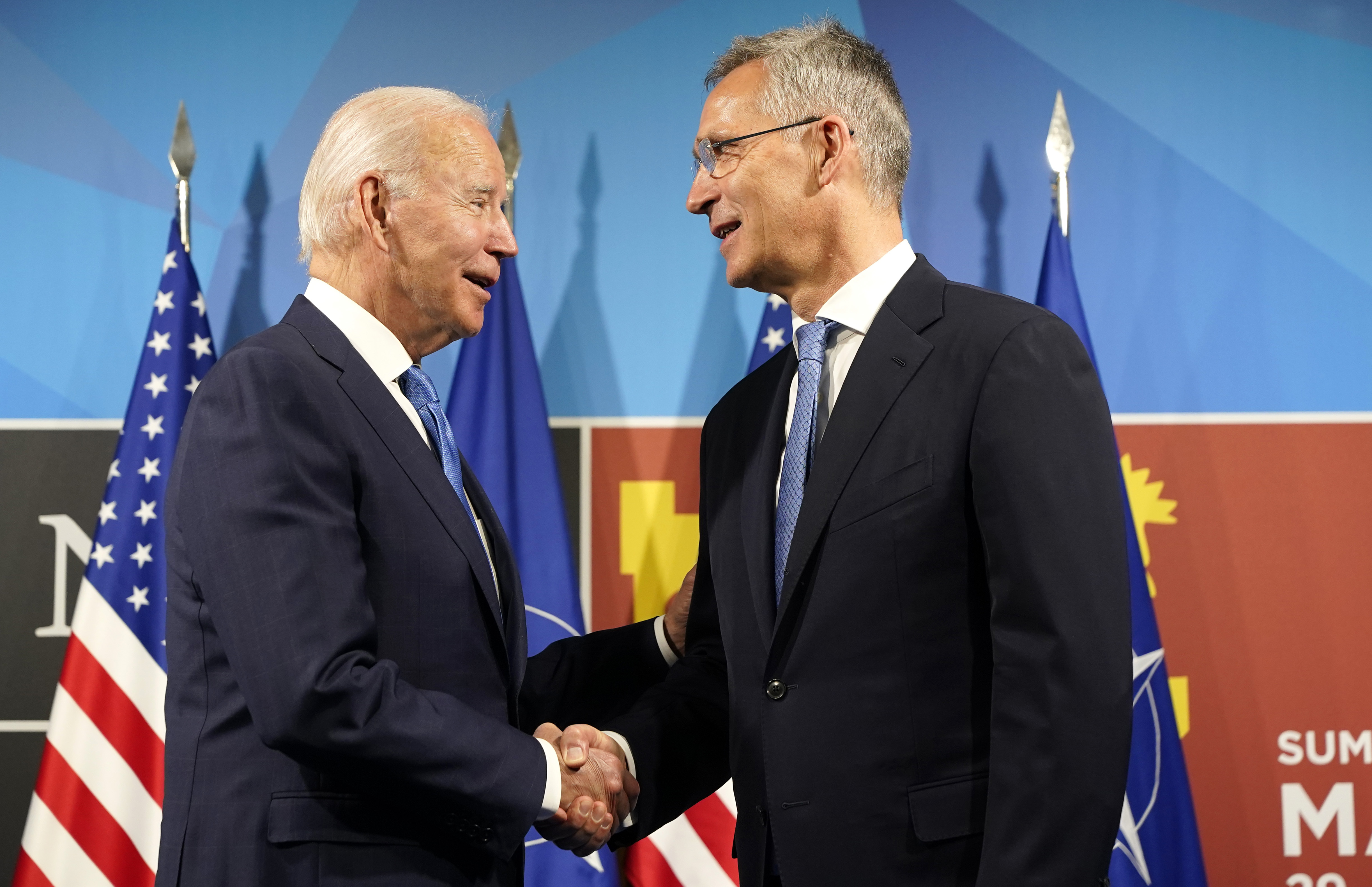 U.S. President Joe Biden, left, is greeted by NATO Secretary-General Jens Stoltenberg during arrival for a NATO summit in Madrid, Spain, on Wednesday. North Atlantic Treaty Organization heads of state and government will meet for a NATO summit in Madrid from Tuesday through Thursday.