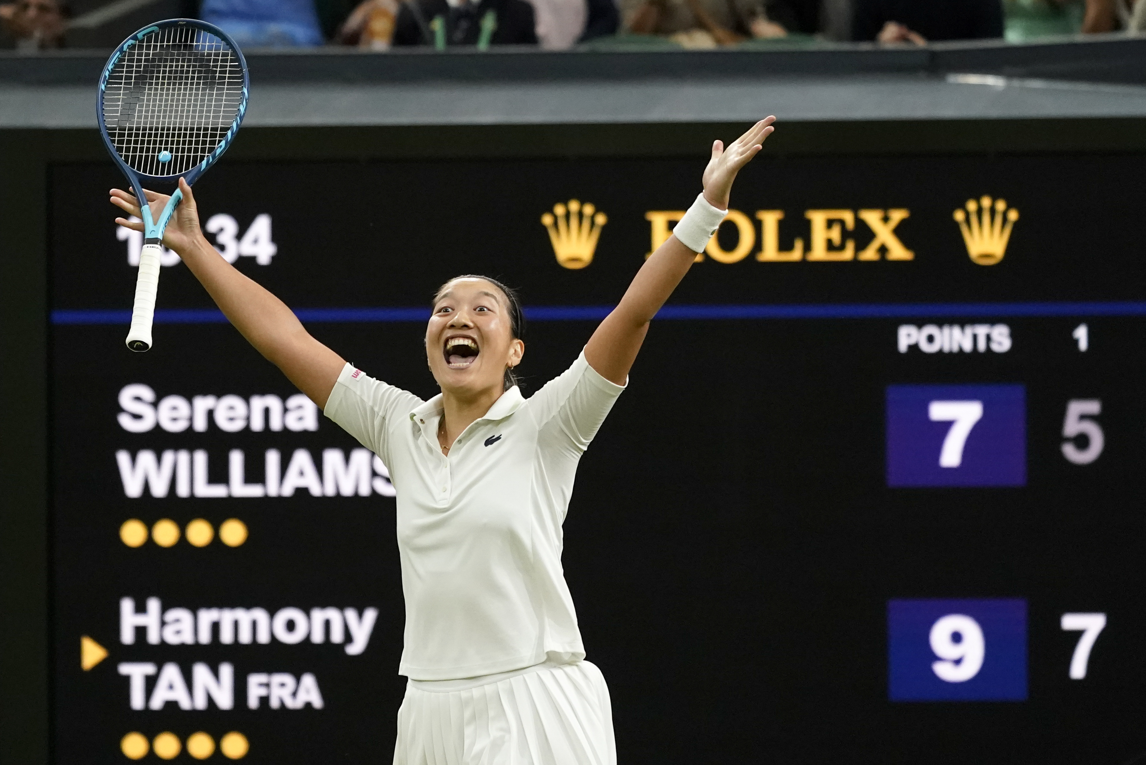 France's Harmony Tan celebrates after beating Serena Williams of the US in a first round women's singles match on day two of the Wimbledon tennis championships in London, Tuesday, June 28, 2022. 