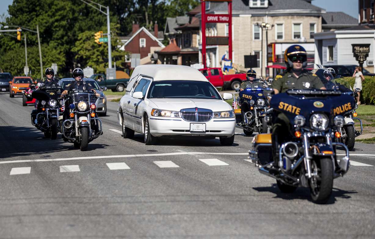 Law enforcement officers lead a procession for Herschel W. “Woody” Williams, the last remaining Medal of Honor recipient from World War II, Wednesday, in Huntington, W.Va. Williams, 98, died Wednesday at the Veterans Affairs medical center bearing his name in Huntington.