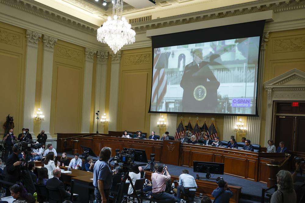 A image of former President Donald Trump is displayed as Cassidy Hutchinson, former aide to Trump White House chief of staff Mark Meadows, testifies as the House select committee investigating the Jan. 6 attack on the U.S. Capitol holds a hearing at the Capitol in Washington, Tuesday.